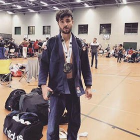 Lee competing in the Martial Art of Brazilian Jiu-Jitsu